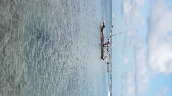 Vertical Video Boats in the Ocean Near the Coast of Zanzibar Tanzania Aerial View alt