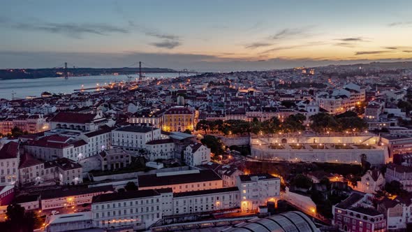 Day to Night Hyperlapse of Residential Buildings and Tourist Landmarks in Lisbon City Center with alt