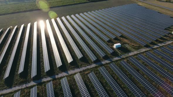 Aerial Shot of a Solar Power Station with Straight Rows of Solar Panels in Ukraine 