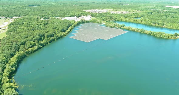Aerial View Solar Panels Floating in Pond alt