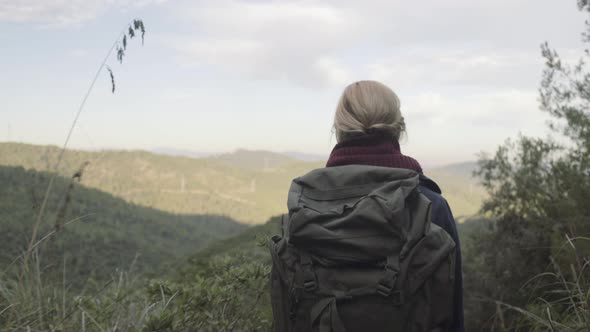 Young Adult Female admiring mountain views