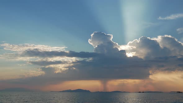 Sunset in Mesologgi Greece. Boat view of the sunset behind clouds and sea horizon. alt