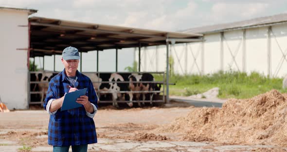 Agriculture Farmer Working on Cowsheed alt