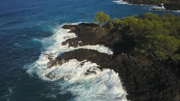 Aerial Of Waves Crashing In To The Shore alt