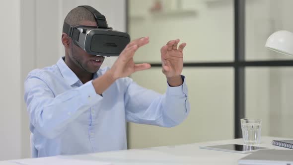 African Man Using VR Glasses for Virtual Reality Experience alt