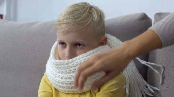 Woman Hugging Sick Son in Scarf, Family Love, Parenthood Support, Health Care