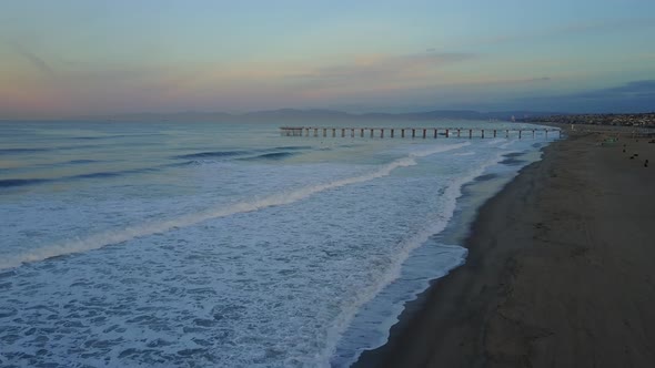 Aerial drone uav view of a pier, beach and ocean. alt