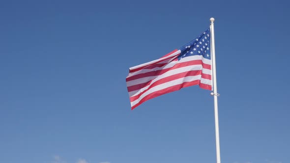 United States of America  flag waving in front of blue sky slow-mo 1080p FullHD footage - Slow motio