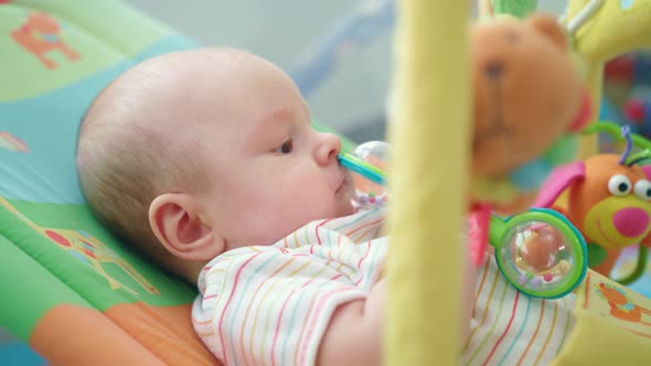 Baby Boy Playing with Toy alt