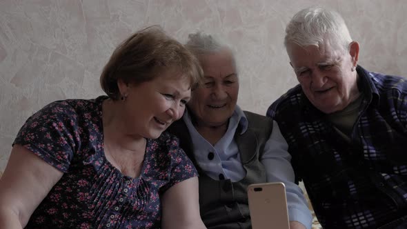 Happy elderly people 80s make video call with family