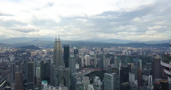 Aerial View on Petronas Twin Towers and Elite Pavillion, Drone Moves Back To Menara, Kuala Lumpur