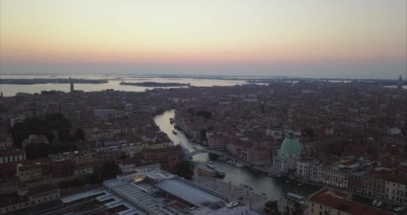 Wide aerial shot of Venice and Scalzi bridge from above at dusk alt