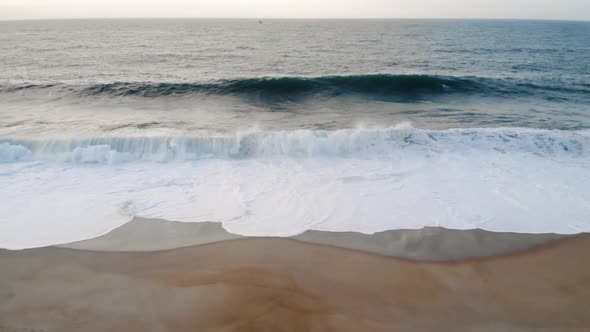 Waves Hitting Sandy Beach