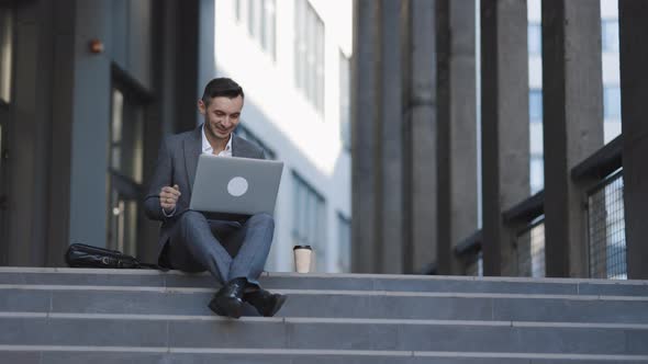 Business Man Talking in Video Conference. Video Conference at City Street alt
