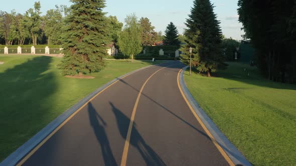 Aerial Shot of Lgbt Couple Biking on Bicycle Lane alt