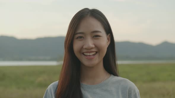 ortrait of beautiful young Asian woman smiling look at camera.