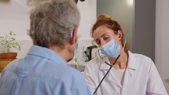 Health Visitor and a Senior Man During Home Visit alt