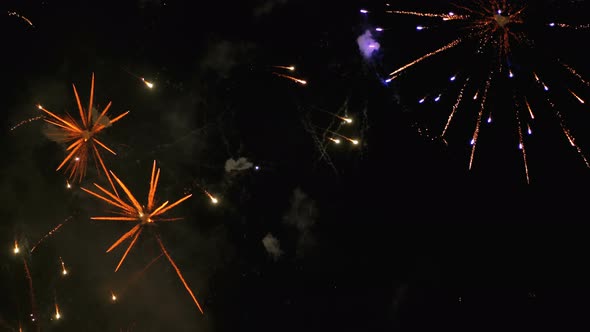 Fireworks Flashing in the Night Sky. Slow Motion. Real Fireworks with Smoke alt