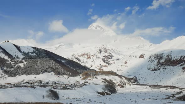 Stepantsminda Town in Morning at Foot of Kazbek Mountain on Background Georgia