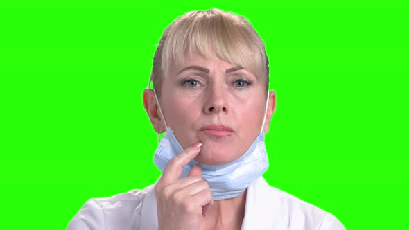 Close Up Mature Doctor Is Thinking. alt