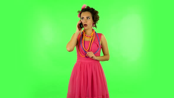 Girl Talking for Mobile Phone, Very Shocked and Rejoices. Green Screen alt