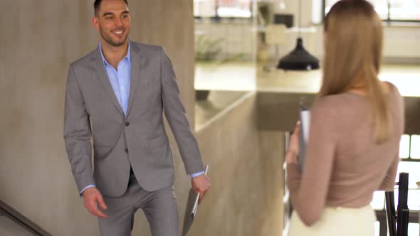 Businessman Meeting Businesswoman at Office Stairs 6 alt