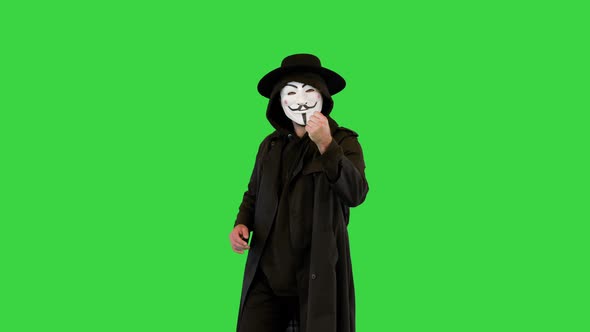Anonymous Wearing Anonym Mask Calling you to Join Him on a Green Screen Chroma Key alt
