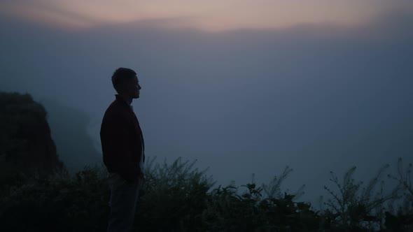 Relaxed Guy Looking Mountain Horizon in Morning Fog alt