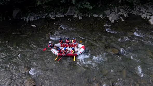 People Rafting at Mountain River Summer Sunny Day alt