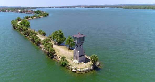 Aerial drone video of lighthouse on a peninsula near Horseshoe Bay, Texas. alt