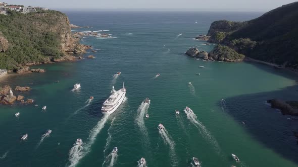 Yacht MV Katharine and local boats approach narrowest part of channel alt