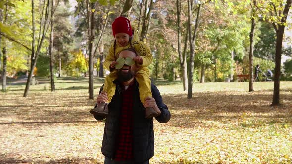 Happy Funny Family Daddy Children Kids Have Fun in Park with Dad Enjoying Autumn Fall Nature Weather