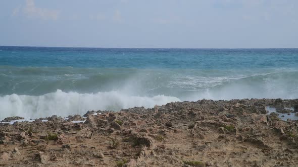 Waves of Mediterranean Sea Near the Rocky Shore