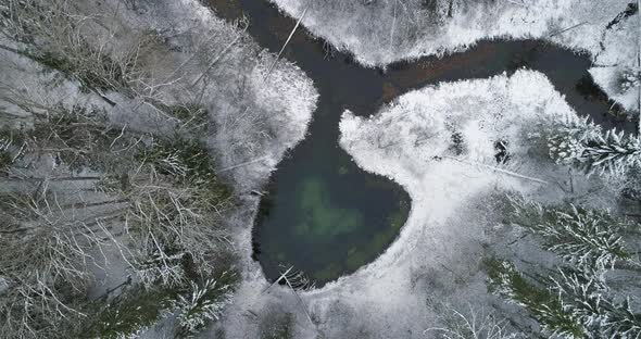 Heart Shape in Nature Spring Lake and River in Winter in Forest Aerial View alt