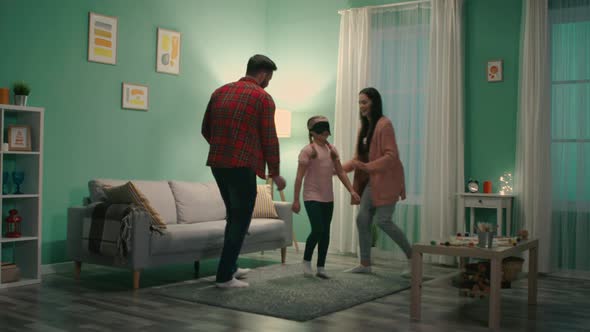 Mom and Dad Are Rotating Small Girl To Play Game alt