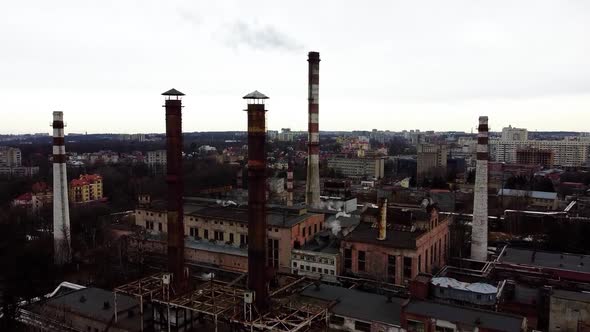 Aerial view of a drone flying over an industrial plant. Plant pipes alt