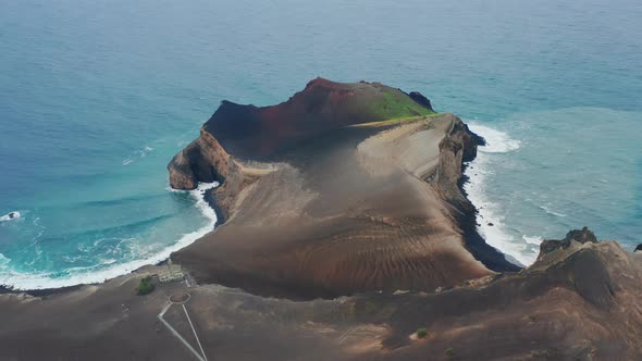 Big Waves Bouncing Against a Rocky Coastline of Capelinhos Volcano Faial Island alt