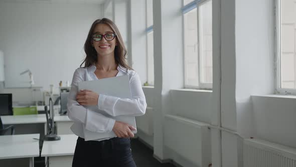 Smiled Young Worker Looks on the Camera alt