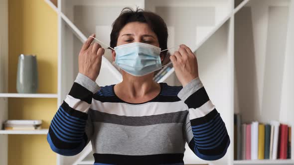 Portrait of a Young Woman with Mask at Home alt