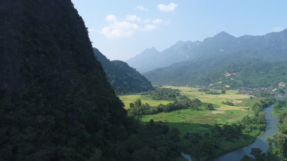 Landscape around the city of Vang Vieng in Laos seen from the sky alt