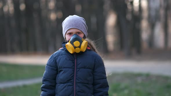 Child in protective mask, face-guard to prevent breathing toxic air