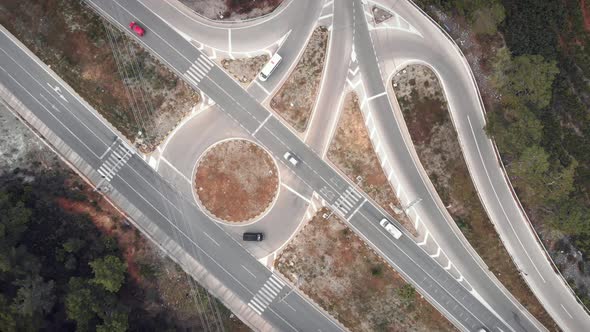 Turning overhead shot of speedy car highway road with busy transport traffic.  alt