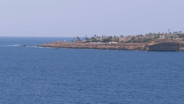 Beaches and Hotels in Egypt Near the Shoreline on the Rocky Beach. Sharm El Sheikh alt