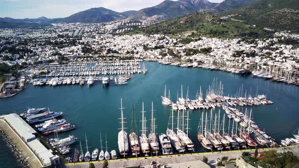 Amazing panoramic view from drone of full of yachts Bodrum harbour and ancient Kalesi castle. alt