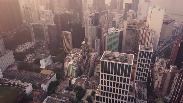 Modern Skyscrapers In Hong Kong City. buildings in Hong Kong city on sunrise. alt