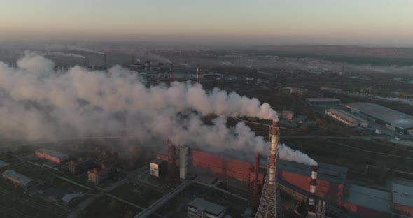 Industrial background of metallurgical production factory. global warming symbol alt