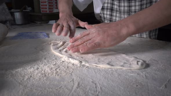 Making Dough With Flour To Make Turkish Pita alt