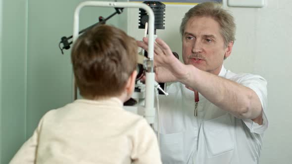 Optometrist Doing Sight Testing for Little Pateient alt