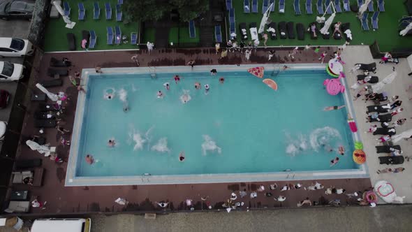 A Lot of People Jumping in the Swimming Pool Aerial View