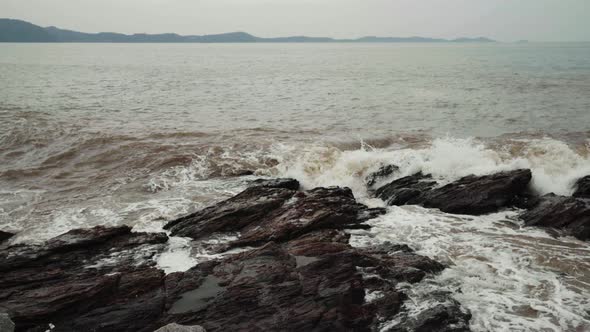 panning shot sea wave with stone at Khao Laem Ya in Mu Ko Samet National Park, Rayong